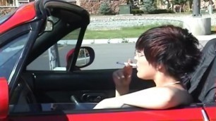Sexy Smoking Shorthair Redhead in Car