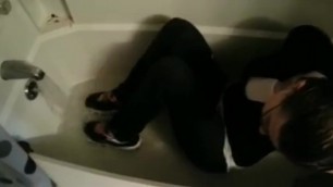 American Girl Fully Clothes in the Bathtub