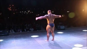 MASSIVE BODYBUILDER ARKADY VELICHKO POSING ON STAGE