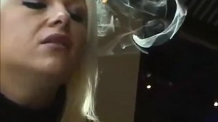 GORGEOUS BLONDE WOMAN SMOKING INSIDE A RESTAURANT