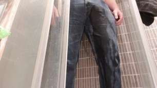 Pissing himself in jeans and chastity cage