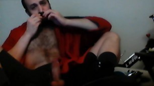 Boots and boy stroking his cock
