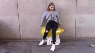 Pretty converse girl sits on balloon to pop!