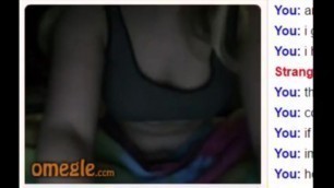 Blonde girl in a dark room showing her tits