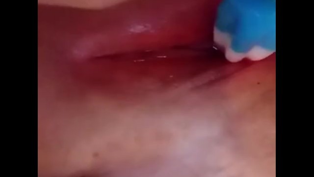 Slut plays with popsicle in her fat pink pussy