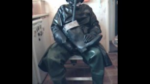 Wanking in new oilskin coat and green rubber waders.