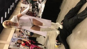 Belly trampling victory pose in platform boots at cosplay party