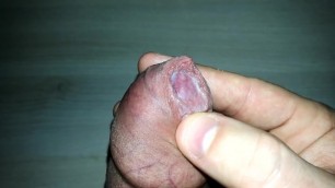 Close up uncut foreskin precum and cumshot