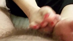 Fiona strokes a lucky cock and gets cum all over her toes