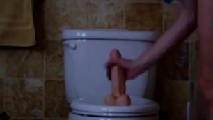 The wife attached the vibrator to the toilet and jumps on it to ecstasy