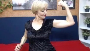 Russian milf babe flexes her biceps