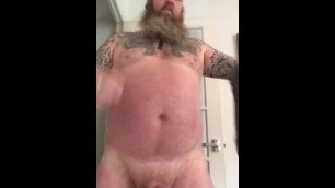 Bearded muscle bear jerking cock with cumshot