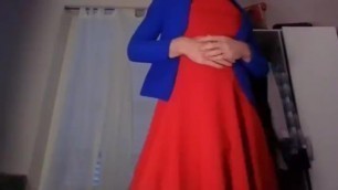 Cross dresser teasing and touching in a sexy red dress and cute blue blazer