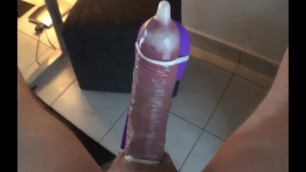 Hitachi Vibrator milks Big Cock in tight Condom empty