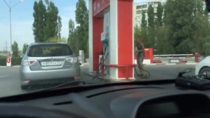 power the car at the gas station by two women