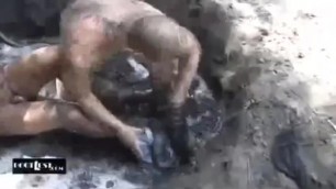 Cop wrestling in mud