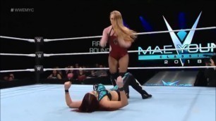 Female wrestler jumps on the belly