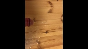 Pissing on the wooden table with my uncut cock