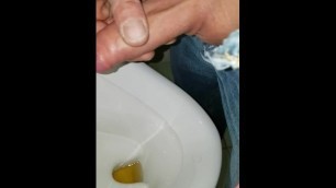 Wank my pissing uncut cock to cumshot in public urinal