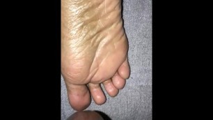 Cumshot on sleepy feet