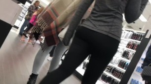 Candid teen in yoga pants shopping with friends